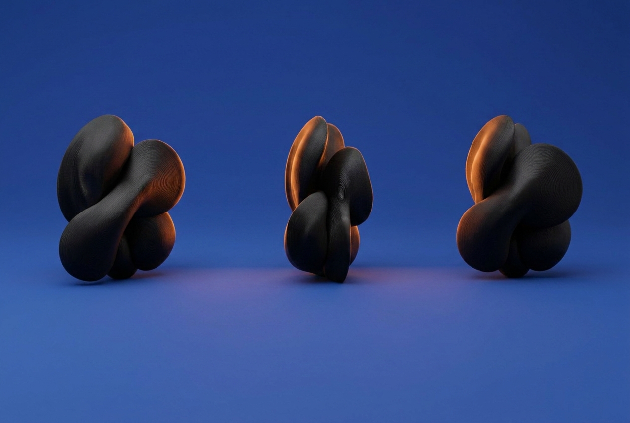 The same sculptures on a deep blue background with warmer side lighting